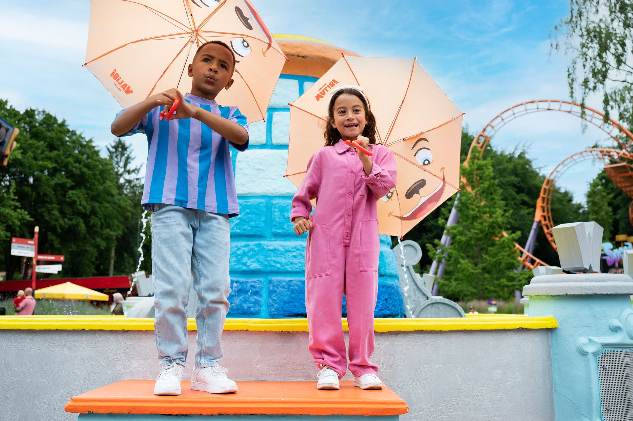 happy kids with umbrella